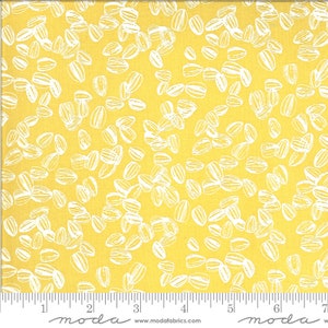 May include: Yellow fabric with a white pattern of sunflower seeds. The fabric has a ruler with the word "moda" printed on it.