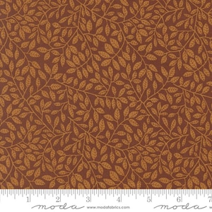 May include: Brown fabric with a repeating pattern of golden-brown leaves and vines. The leaves are detailed with visible veins, creating a natural, organic design. The fabric has a textured appearance, suitable for quilting or other crafts.