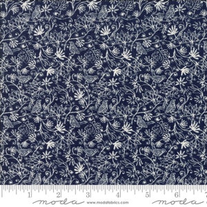 May include: Navy blue fabric with a white floral and bird pattern. The design features detailed illustrations of flowers, leaves, and birds, creating a dense, all-over print. The fabric is suitable for various sewing and crafting projects.
