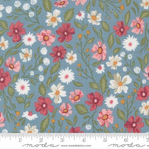 May include: Floral fabric with a light blue background. The fabric features a repeating pattern of red, pink, and white flowers with yellow centres, green leaves, and thin vines. The fabric has a ruler along the bottom edge.