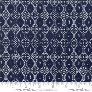 May include: A navy blue fabric with a white geometric pattern. The pattern features a repeating design of squares and diamonds with a small paisley-like shape in the center of each square.