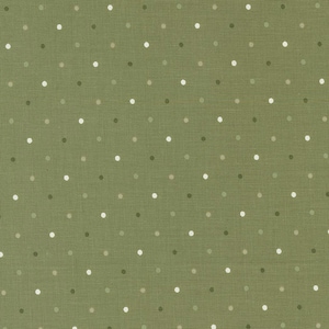 May include: Olive green fabric with a repeating pattern of small, evenly spaced polka dots in shades of white, gray, and darker green. The fabric has a textured appearance, suggesting a woven material.