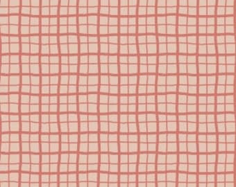 May include: A fabric with a grid pattern in a coral color over a light beige background. The grid lines are uneven, creating a hand-drawn appearance. The fabric is shown with a ruler along the bottom edge, with measurements in inches.