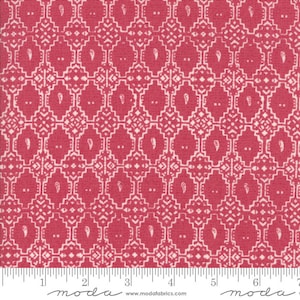 May include: Red fabric with a white geometric pattern. The pattern features small white diamonds and paisley shapes. The fabric is marked with a ruler and the words "moda" and "www.modafabrics.com".