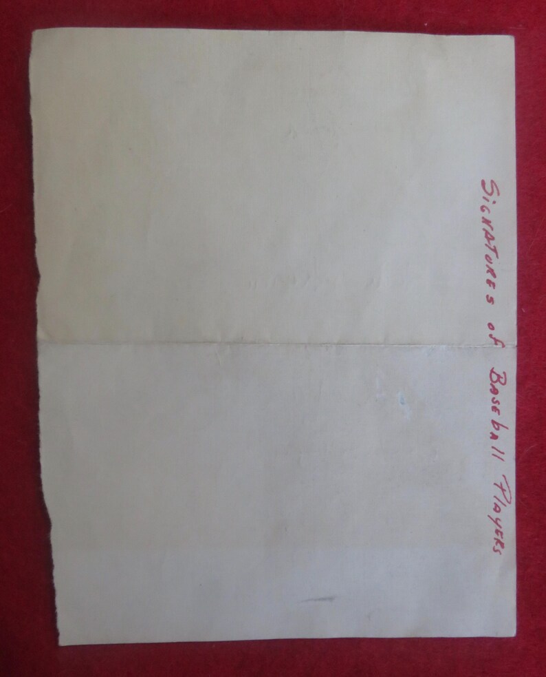 May include: A blank white sheet of paper with the text "Signatures of Baseball Players" written in red ink at the bottom right corner.