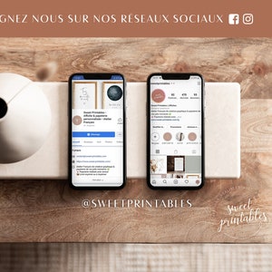 May include: Two screenshots of Instagram profiles on a wooden surface. The first profile is for "Sweet Printables" and features a graphic of a woman with a paintbrush. The second profile is for "Sweet Printables" and features a graphic of a circle with the text "Sweet Printables" inside. Both profiles have a light pink background.