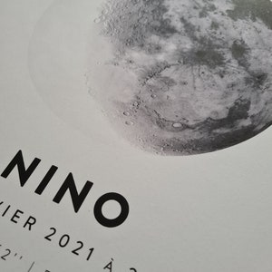 May include: A black and white image of the moon with the text "NINO" and "JANVIER 2021 &Agrave; 21:35 - 22' | E5&deg;55'13"