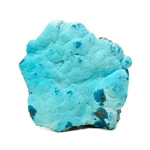 May include: A large, blue, irregularly shaped piece of turquoise mineral with a rough, textured surface.
