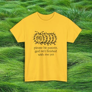 Vintage Caterpiller Design Tshirt: "Please Be Patient God Isn't Finished With Me Yet"