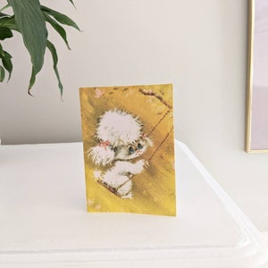 Adorable carte de voeux vierge vintage des années 1970, mignonne créature illustrée de chien moelleux, bonhomme de neige abominable sur une balançoire par Rust Craft Canada