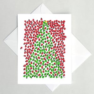 May include: A white greeting card with a colorful ladybug design. The ladybugs are red, green, and one yellow, with black spots. The card is inside a white envelope.