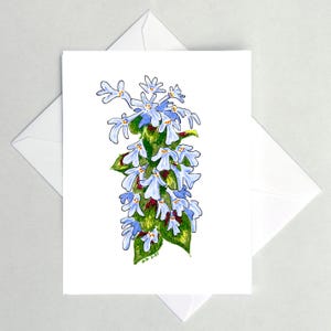 Pode incluir: Uma placa de madeira rústica com o texto "Welcome to our home" em letras brancas. A placa apresenta um acabamento desgastado e um design simples e convidativo, perfeito para a decoração da porta da frente.