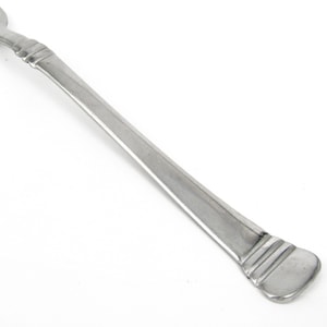 May include: A stainless steel serving spoon with a long, slender handle and a rounded, slightly flattened end. The handle features a decorative design near the spoon's bowl. The spoon is angled diagonally against a white background.