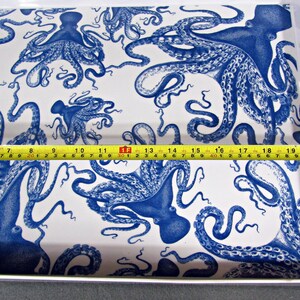 May include: A rectangular serving tray with a white background and a repeating pattern of blue octopus illustrations. The tray measures approximately 20 inches long.