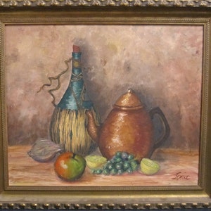 May include: Oil painting of a still life with a copper teapot, a bottle wrapped in straw, and fruit. The painting has a warm color palette with a gold frame. The fruit includes a green apple, grapes, and lemons.