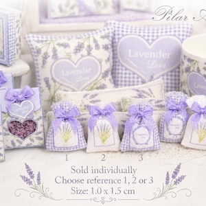 May include: A collection of miniature lavender-themed items including small fabric sachets, pillows, and boxes. The items feature purple lavender sprigs, heart motifs, and the text "Lavender Love". Some sachets are labeled 1, 2, or 3, with a size of 1.0 x 1.5 cm.