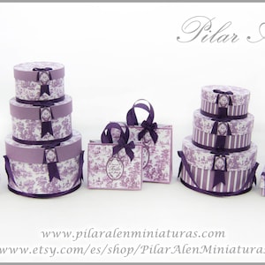 May include: A set of purple and white patterned gift boxes with ribbon accents. The boxes are stacked in various sizes and shapes, including round and square. The boxes are decorated with a delicate floral pattern and have a vintage aesthetic.