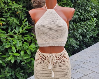 Crochet 2 pieces in beige colour (top and mini skirt). Skirt with coconut buttons and string tassels, size XS/S