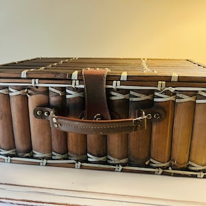 Vintage picnic basket with supplies