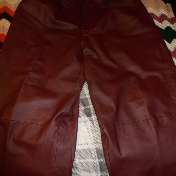SALE Mans maroon colored leather pants,44 by 27.5 inseam with a tall rise of 14.5 ,very gently used.