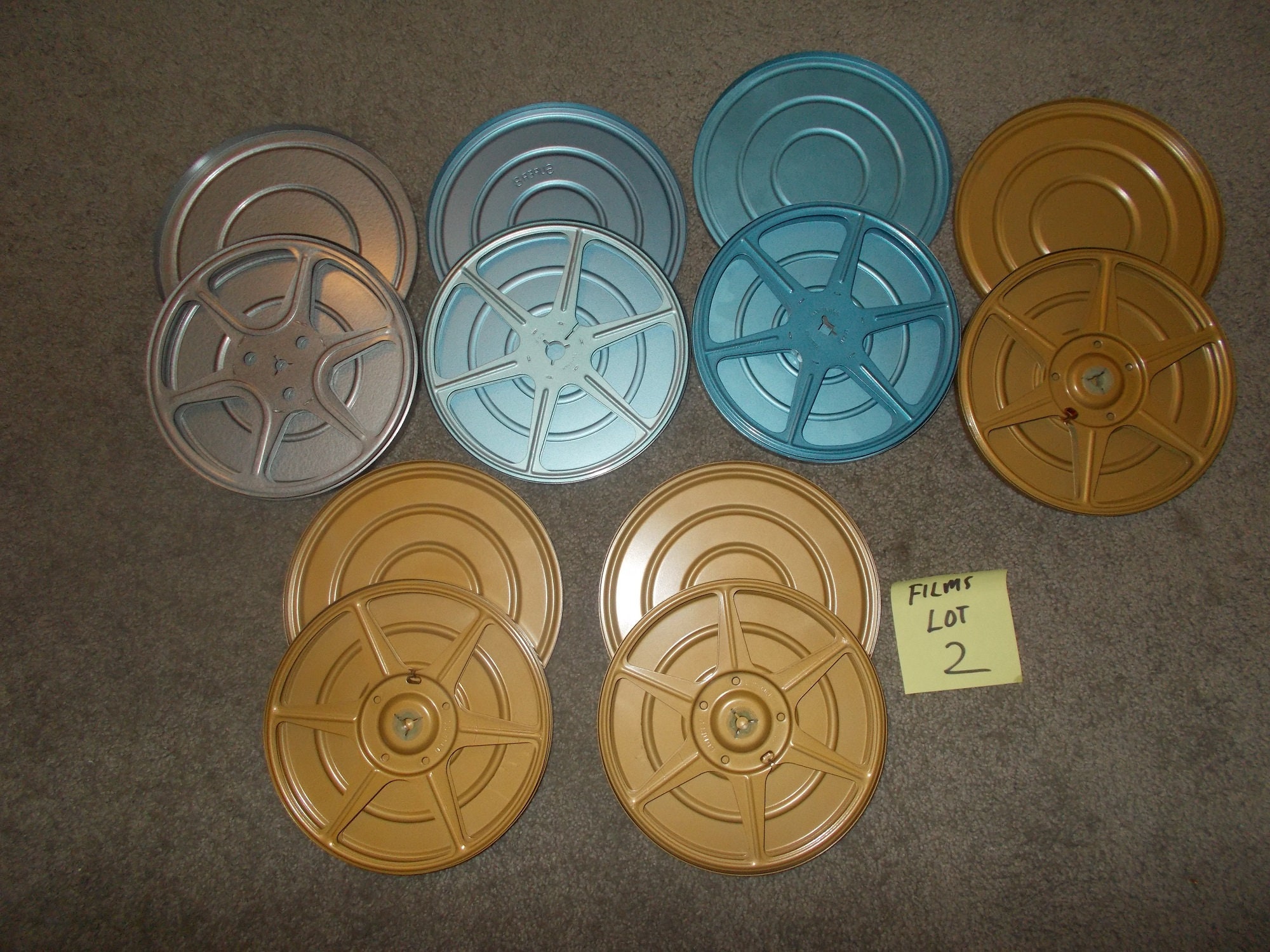 6 film - 8mm reels and metal cases,7 inch,real nice shape,you get all 6,  lot 2