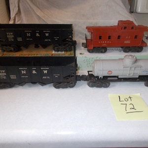 Sale now 1956 Lionel electric trains,2 bottom dump cars,Gulf oil car,caboose 027 or 0  gauge