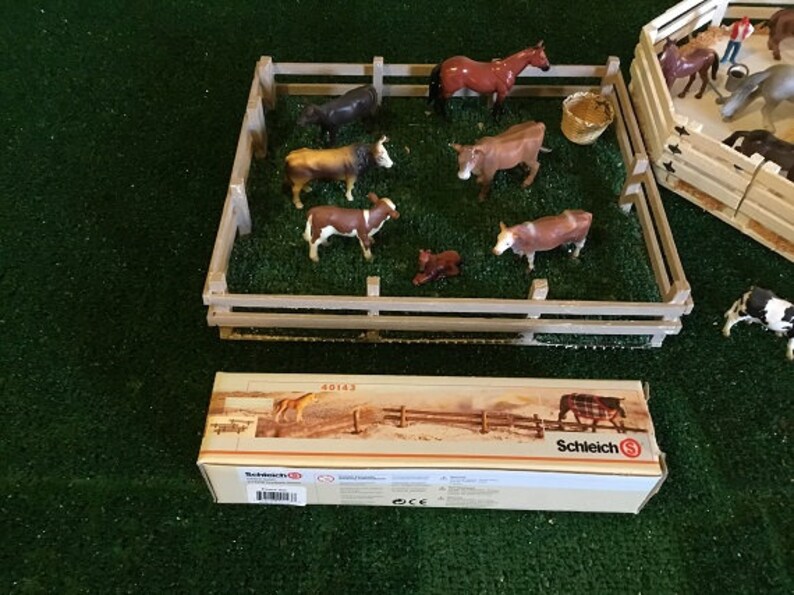 Model farm,ranch animals by Schleich,and wood corrals,scaled to 116 Ertl farm tractors