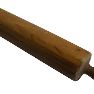 May include: A cylindrical wooden rolling pin with a smooth, light brown finish. The tool features a central barrel section for flattening dough and two rounded handles on either end, showing natural wood grain patterns and a worn, polished texture.