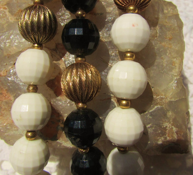 LISNER Black White Beads with Fancy Fluted Gold Tone Accents Bracelet