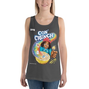 May include: Dark gray tank top featuring a colorful cartoon illustration. The graphic includes the text "CON CRUNCH" above a bowl of cereal with a character holding a spoon. A rainbow and other graphics are also present.