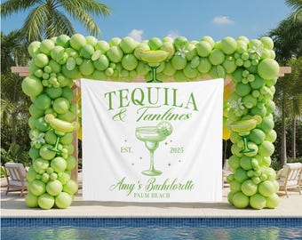 May include: A decorative arch made of green balloons and margarita-themed decorations surrounds a white banner. The banner reads "TEQUILA & Tantines" with "Amy's Bachelorette PALM BEACH" below. The scene is set by a pool.