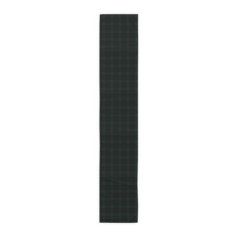 May include: A rectangular table runner featuring a dark green and black plaid pattern. The textile displays a consistent grid of intersecting thin lines in a deep forest green hue layered over a solid black background, creating a classic tartan design.