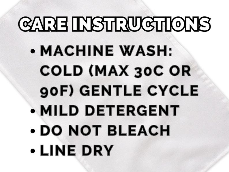 May include: White fabric label with black text detailing care instructions. The text includes: machine wash cold (max 90F) gentle cycle, mild detergent, do not bleach, and line dry.