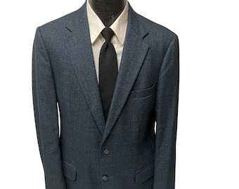 May include: A dark blue blazer with a two-button fastening and a black tie.