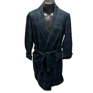 May include: A long-sleeved robe with a plaid pattern in shades of green and blue. The robe has a shawl collar, a tie belt, and two pockets.
