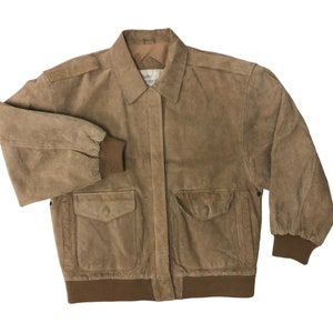 May include: A brown suede bomber jacket with a zipper closure, two flap pockets, and ribbed cuffs and waistband.