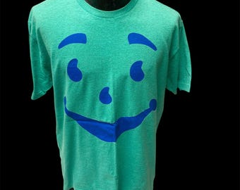 Vintage 80-tals KOOL AID herrtröja med HEATHER-motiv och blått leende, L