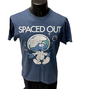 Camiseta vintage de los años 80 de Los Pitufos en azul jaspeado con el astronauta SPACED OUT Peyo Astro SMURF UsA Cartoon M