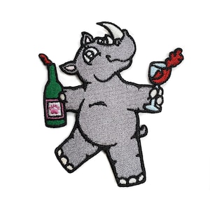 May include: Embroidered iron-on patch of a gray rhinoceros holding a bottle of wine in one hand and a glass of wine in the other.
