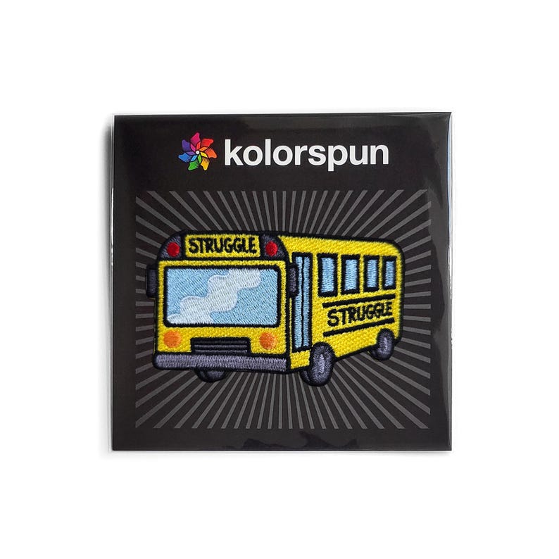 May include: A yellow school bus embroidered patch with the word "STRUGGLE" on the front and back. The patch is on a black background with a white starburst pattern.