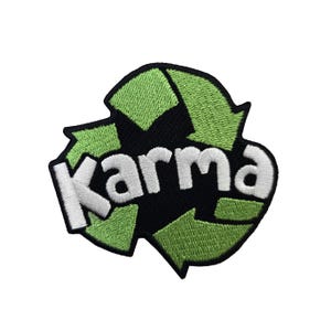 May include: Green and black embroidered patch with the word "Karma" in white lettering, shaped like a recycling symbol.