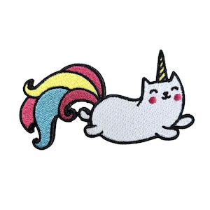 May include: An embroidered patch featuring a white cat with a yellow and black striped unicorn horn on its head, pink cheeks, and a large, flowing tail with sections of yellow, blue, and magenta, all outlined in a thick black border.