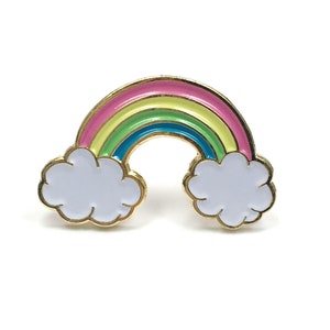 May include: A gold-tone rainbow enamel pin with white clouds on either side. The rainbow is made up of pink, yellow, green, and blue enamel.