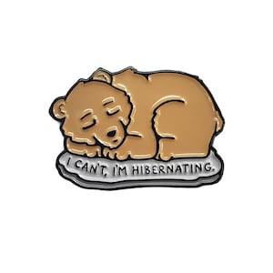 May include: A brown bear sleeping on a white cloud with the text "I can't, I'm hibernating."  The bear is curled up in a ball with its head resting on its paws. The cloud has a black outline.