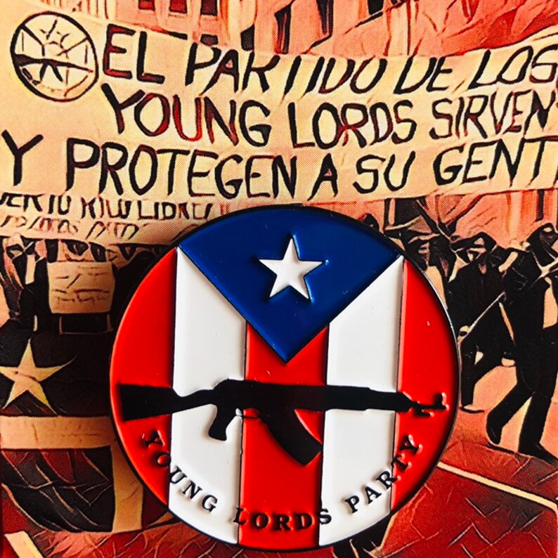 May include: A round pin with the Puerto Rican flag and a black silhouette of an assault rifle. The text "Young Lords Party" is written around the bottom of the pin.