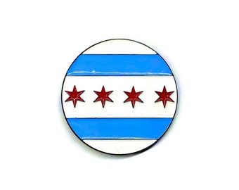 May include: A round pin with a blue, white, and red design. The pin features four red stars on a white background with two blue stripes.
