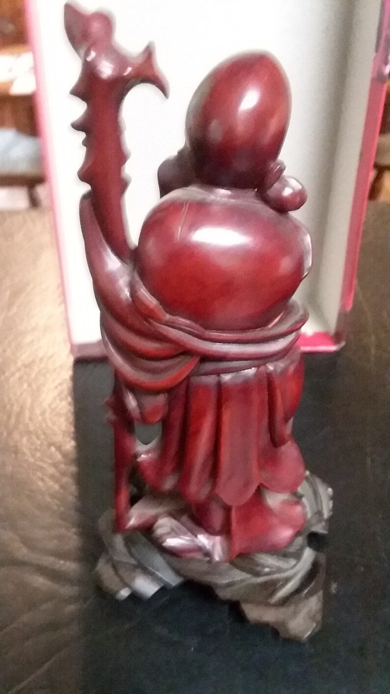 Chinese hand carved budda with ivory eyes and teeth