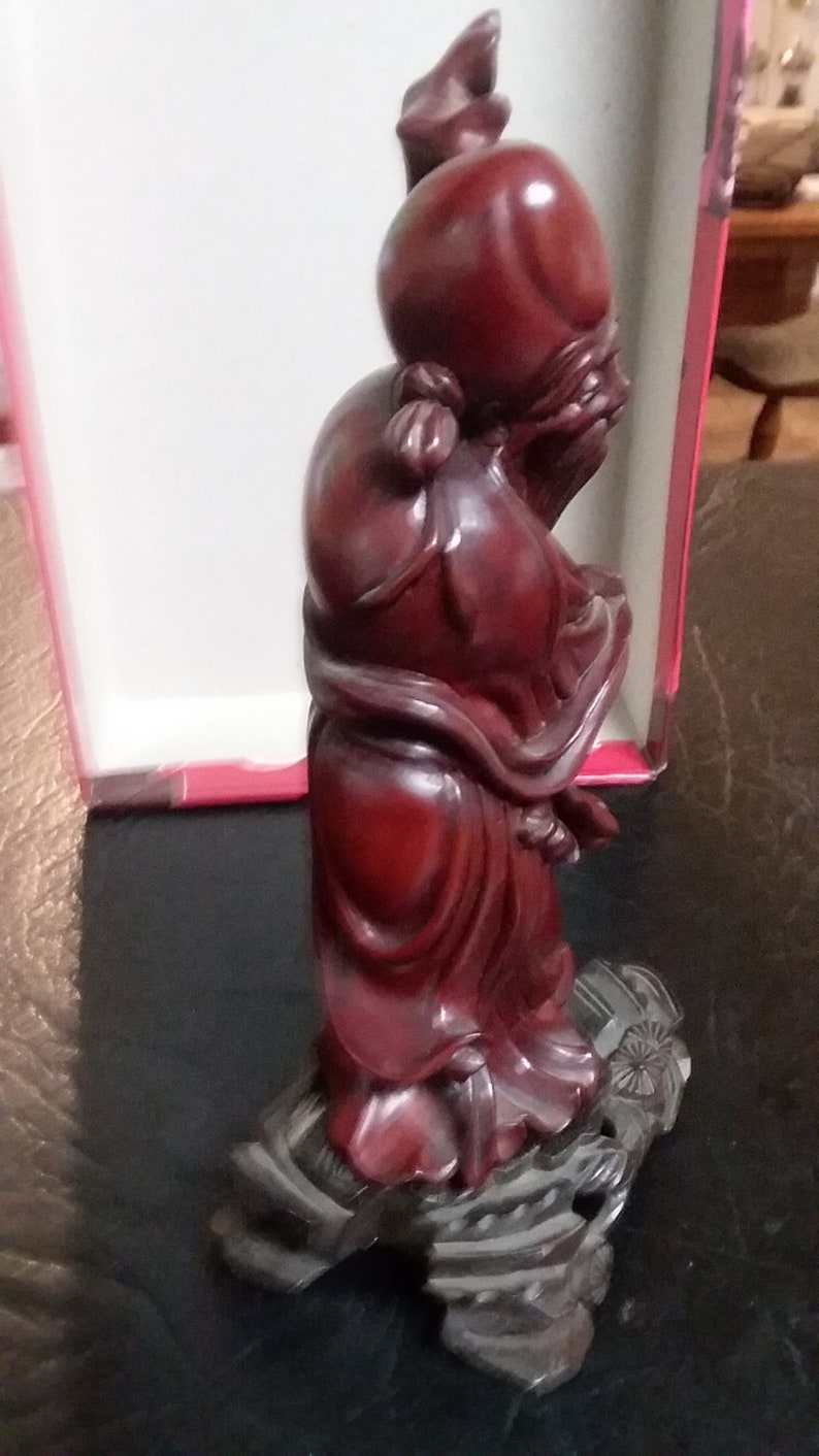 Chinese hand carved budda with ivory eyes and teeth