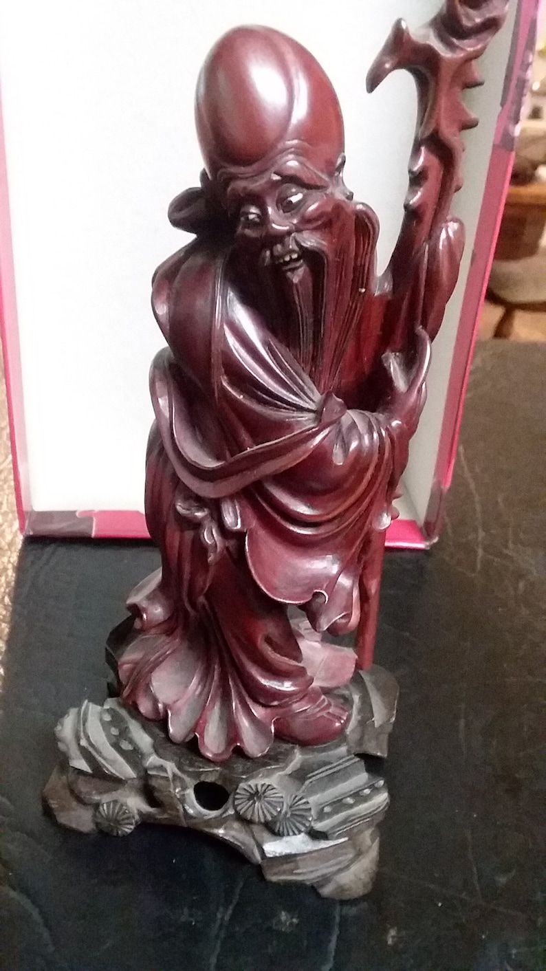 Chinese hand carved budda with ivory eyes and teeth