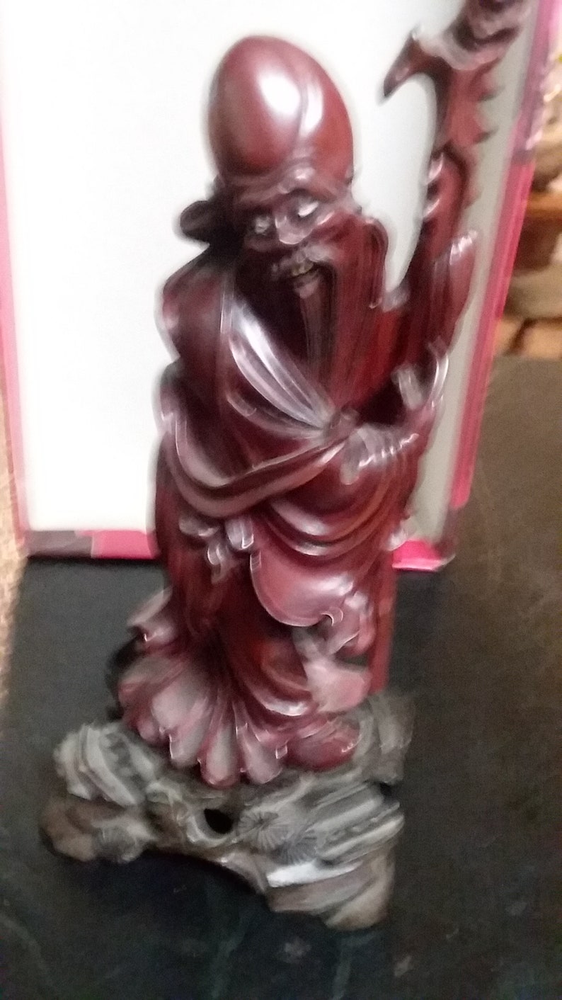 Chinese hand carved budda with ivory eyes and teeth
